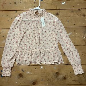 Francesca‘s pink blouse